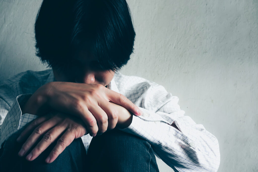 Serious man,young man sitting thinking about something.