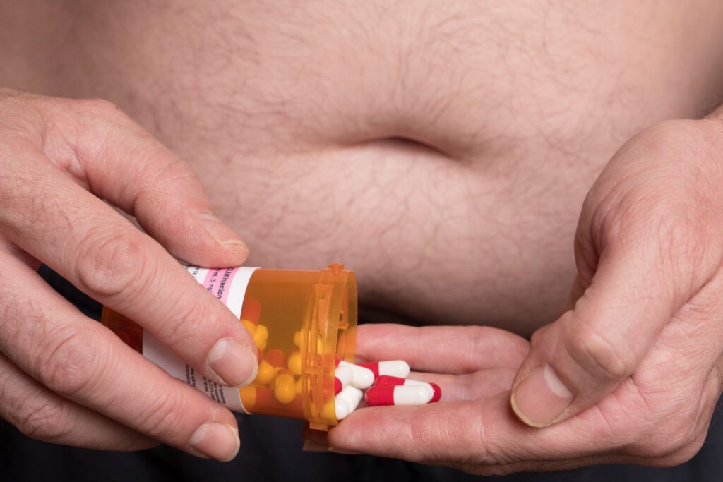 Midsection man having medicines home
